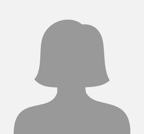 A grey silhouette icon of a person with short hair from the shoulders up against a plain background.